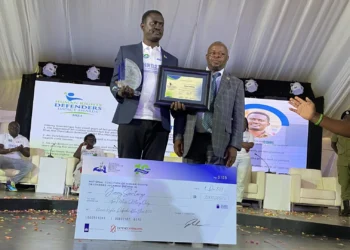 Spire Ssentongo, a cartoonist, receives the Human Rights Defender Award 2023