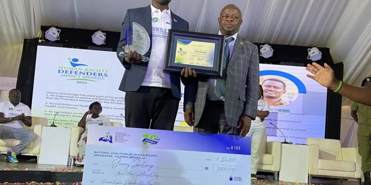 Spire Ssentongo, a cartoonist, receives the Human Rights Defender Award 2023